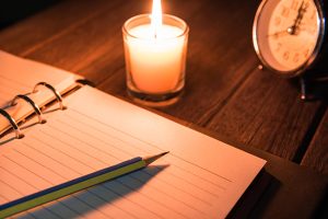 Journal page with candle and clock